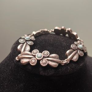 Br19. Silver colored bracelet.